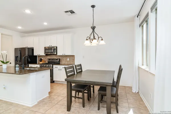 a view of a dining room with furniture