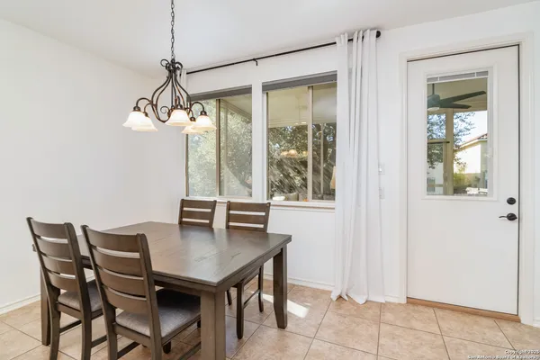 a view of a dining room with furniture window and outside view