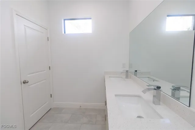 a bathroom with a sink and tub