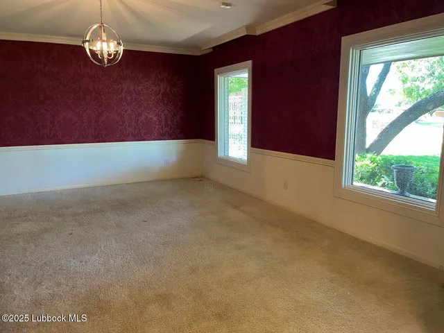 a large room with furniture and a flat screen tv