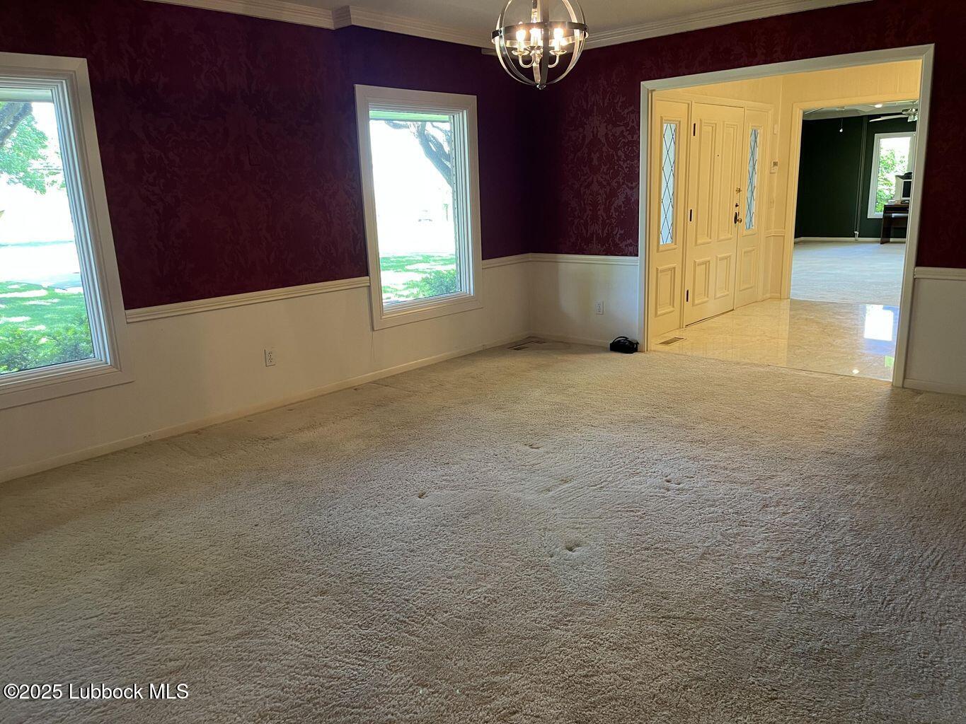103 Yucca Terrace Plainview, TX 79072 - Photo 13 of 79 a view of an empty room with a window