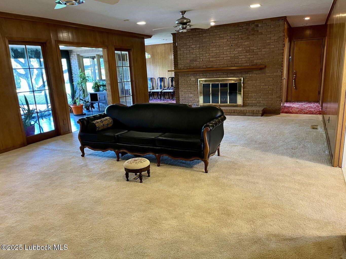 103 Yucca Terrace Plainview, TX 79072 - Photo 14 of 79 a living room with furniture and a fireplace