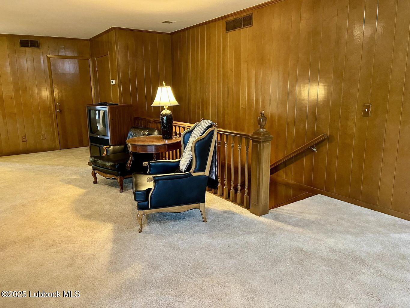 103 Yucca Terrace Plainview, TX 79072 - Photo 16 of 79 a bed room with a bed and a chandelier