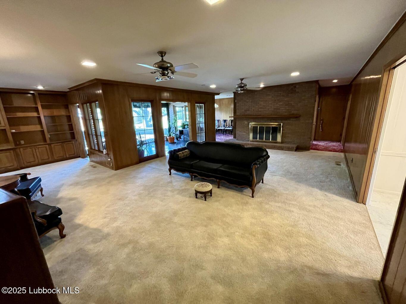 103 Yucca Terrace Plainview, TX 79072 - Photo 18 of 79 a living room with furniture and a flat screen tv