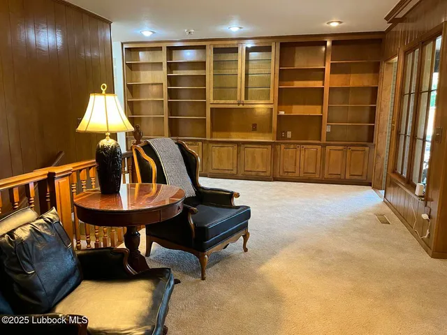 a view of a living room with furniture and closet