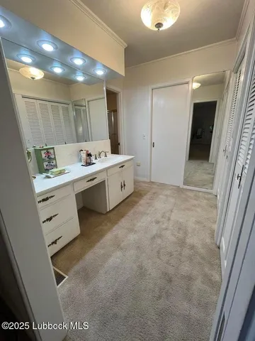 a bedroom with a bed and cabinets