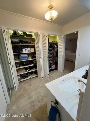 a bed sitting in a room next to a window