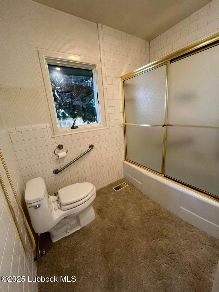 103 Yucca Terrace Plainview, TX 79072 - Photo 29 of 79 a bathroom with a toilet sink and shower