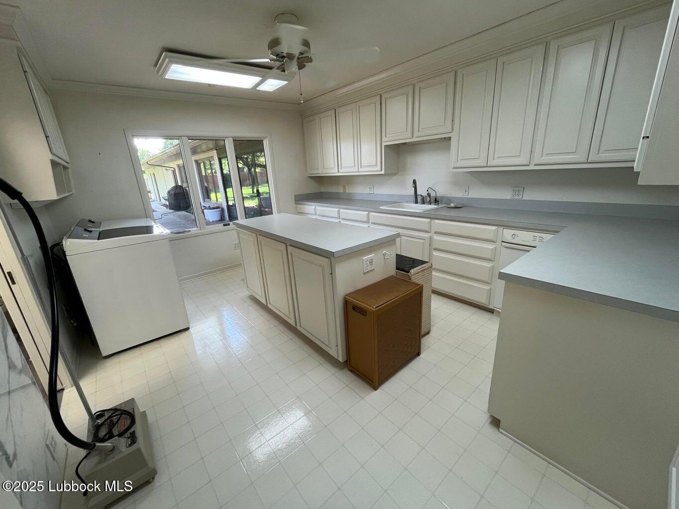 103 Yucca Terrace Plainview, TX 79072 - Photo 35 of 79 a kitchen with stainless steel appliances granite countertop a stove a sink and a refrigerator