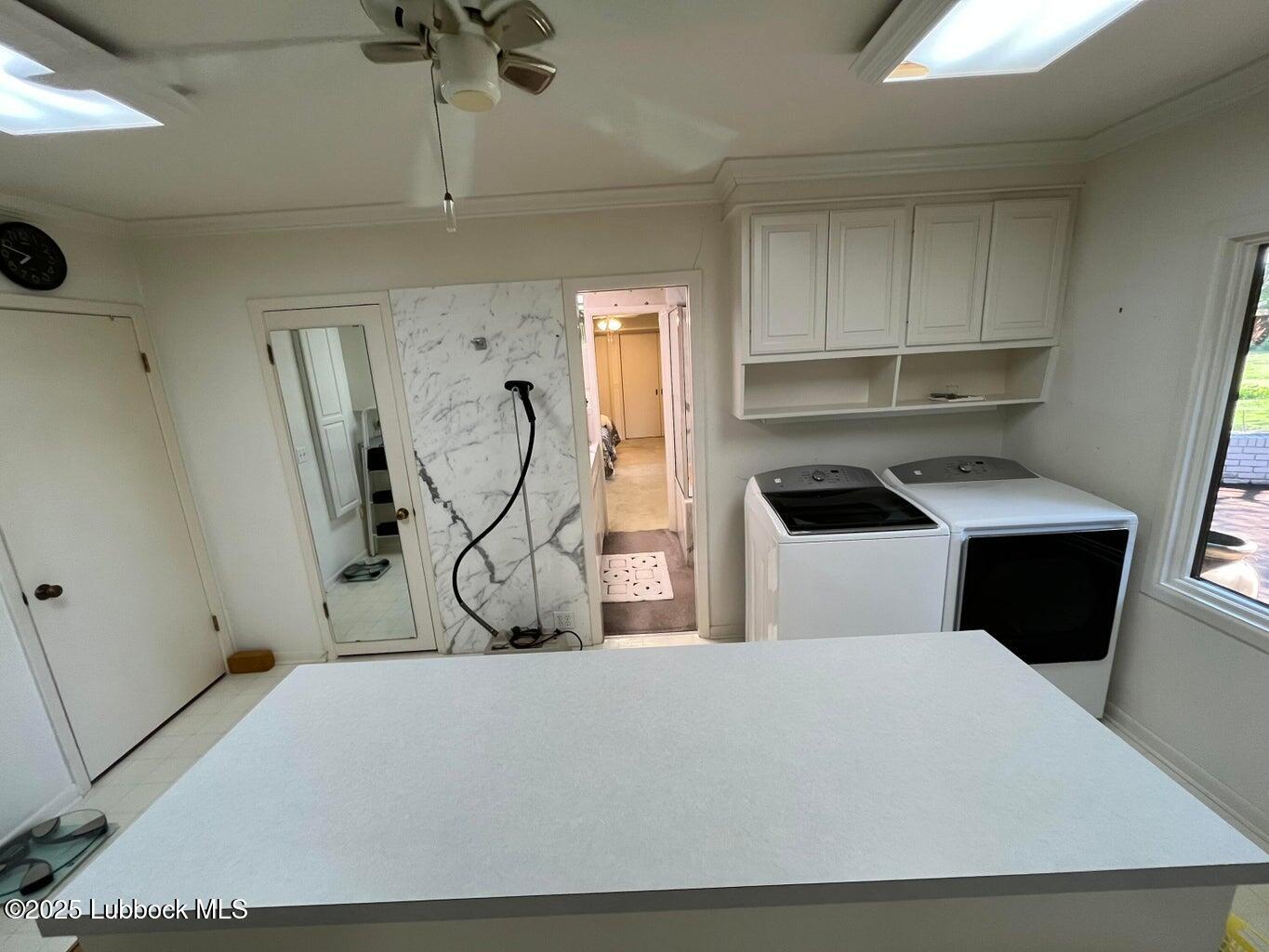 103 Yucca Terrace Plainview, TX 79072 - Photo 37 of 79 a bedroom with a bed and cabinets