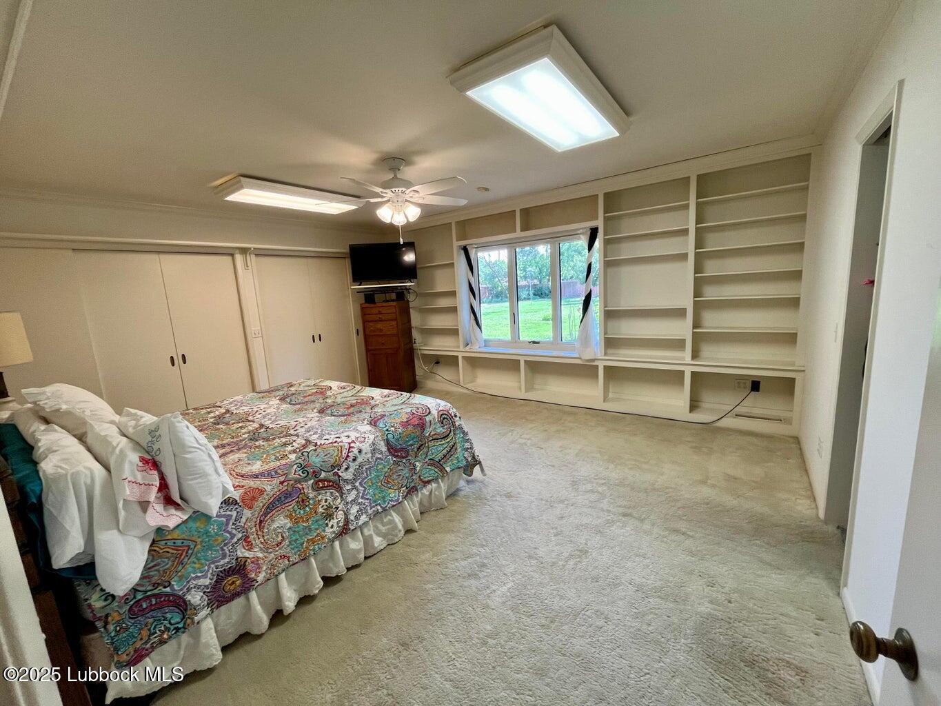 103 Yucca Terrace Plainview, TX 79072 - Photo 41 of 79 a bed room with a bed and a window