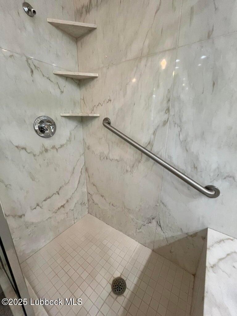 103 Yucca Terrace Plainview, TX 79072 - Photo 49 of 79 a bathroom with a shower