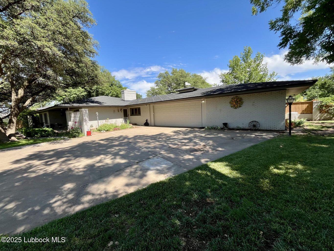 103 Yucca Terrace Plainview, TX 79072 - Photo 5 of 79 a view of a house with a yard