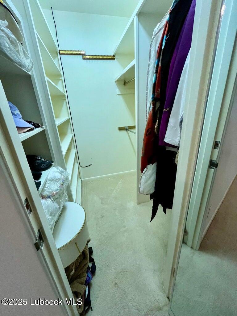 103 Yucca Terrace Plainview, TX 79072 - Photo 52 of 79 a bathroom with a sink a toilet and shower