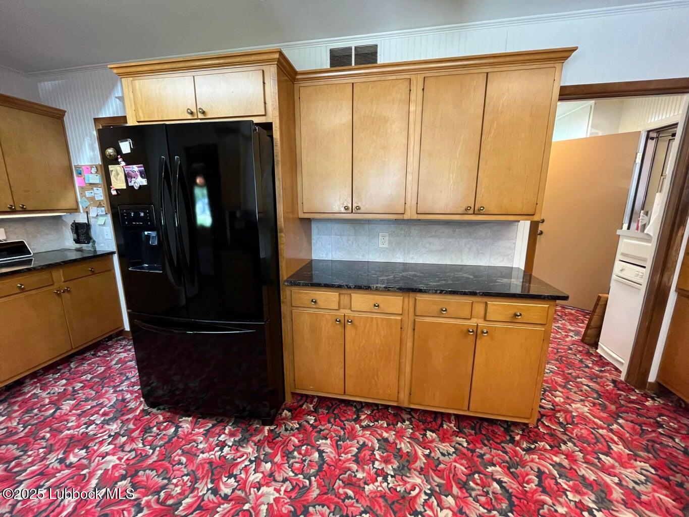 103 Yucca Terrace Plainview, TX 79072 - Photo 67 of 79 a view of a refrigerator in kitchen and a window