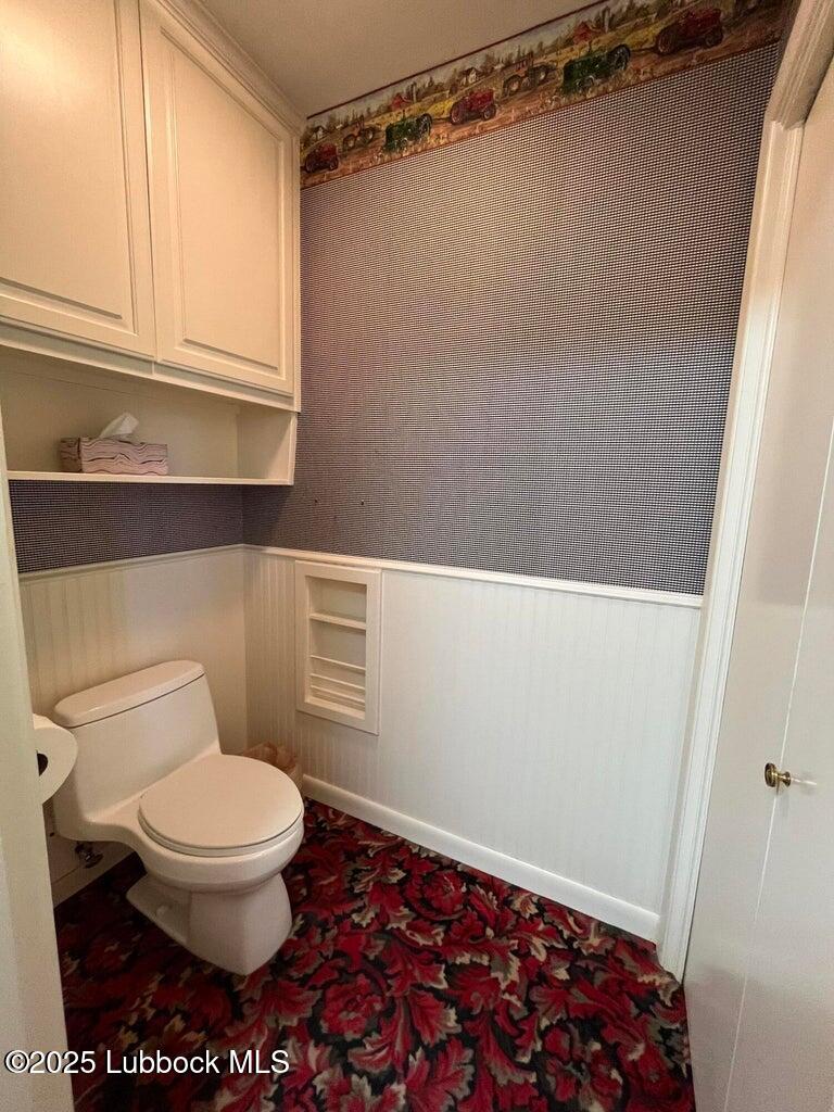 103 Yucca Terrace Plainview, TX 79072 - Photo 70 of 79 a bathroom with a toilet and a shower