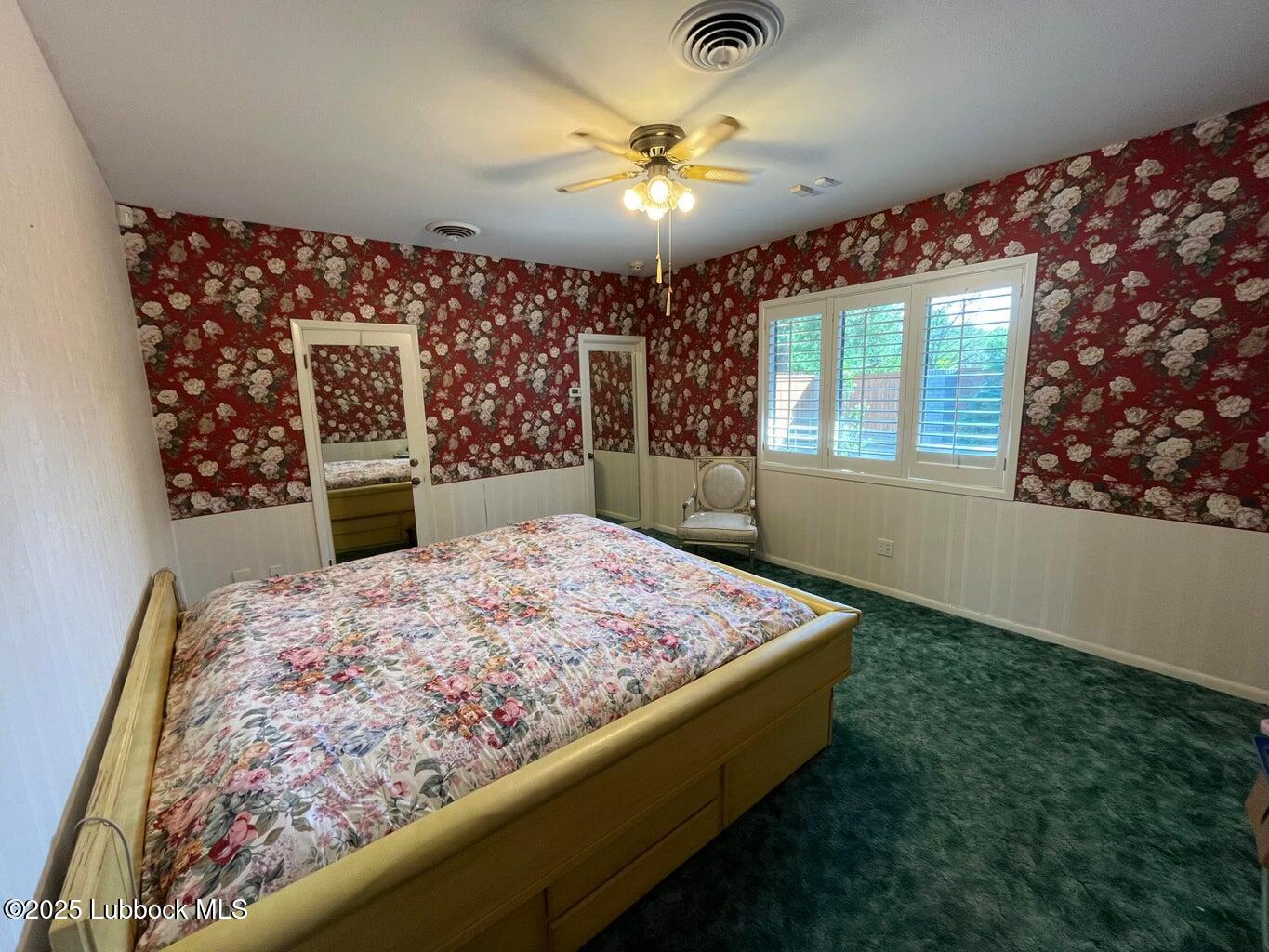 103 Yucca Terrace Plainview, TX 79072 - Photo 7 of 79 a spacious bedroom with a bed dresser and a large window