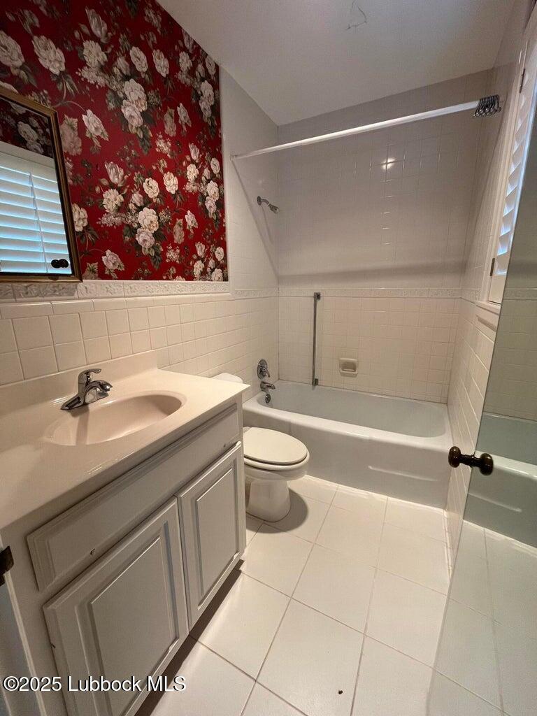 103 Yucca Terrace Plainview, TX 79072 - Photo 71 of 79 a bathroom with a sink a toilet and shower