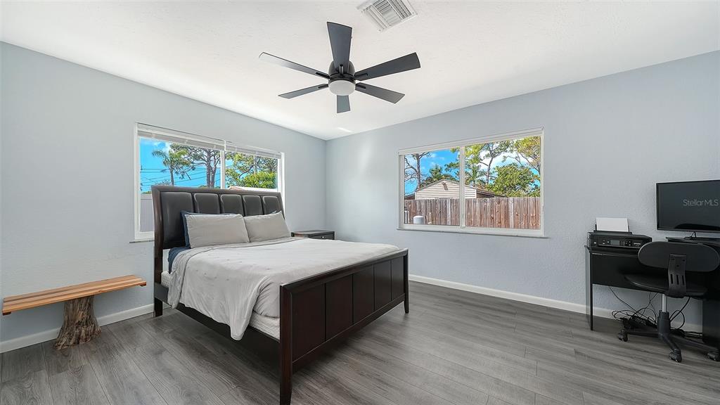 972 Leeward Road Venice, FL 34293 - Photo 18 of 27 a bedroom with a bed and a window