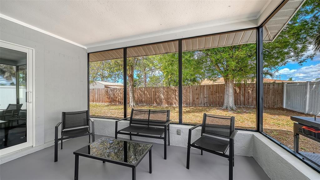 972 Leeward Road Venice, FL 34293 - Photo 21 of 27 a living room with furniture and a large window