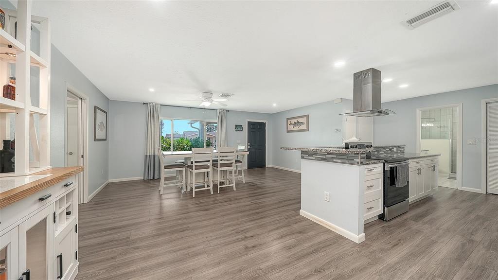 972 Leeward Road Venice, FL 34293 - Photo 9 of 27 a kitchen with a table and chairs in it