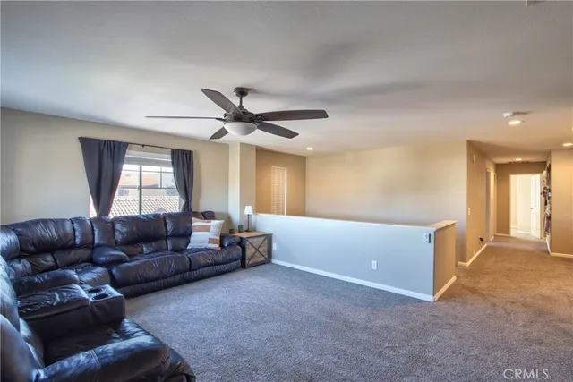a living room with furniture and window