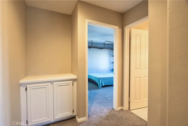 a view of bathroom with a sink and a mirror