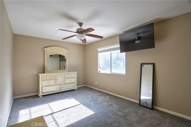 a room with a large bed and a chandelier