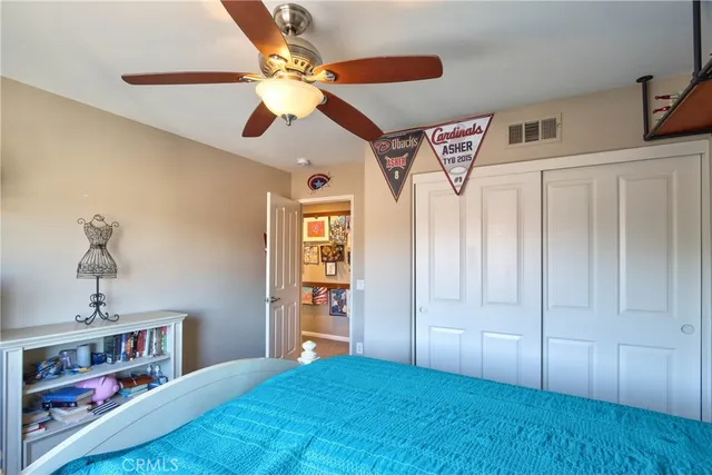 a bedroom with furniture and a chandelier