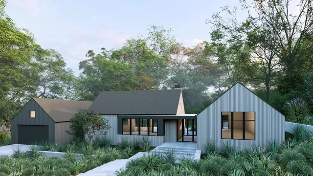 a front view of a house with a yard and trees