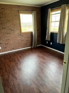 100 2nd Street Glen Rose, TX 76043 - Photo 11 of 11 an empty room with wooden floor and windows