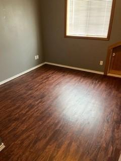 100 2nd Street Glen Rose, TX 76043 - Photo 10 of 11 an empty room with wooden floor and windows