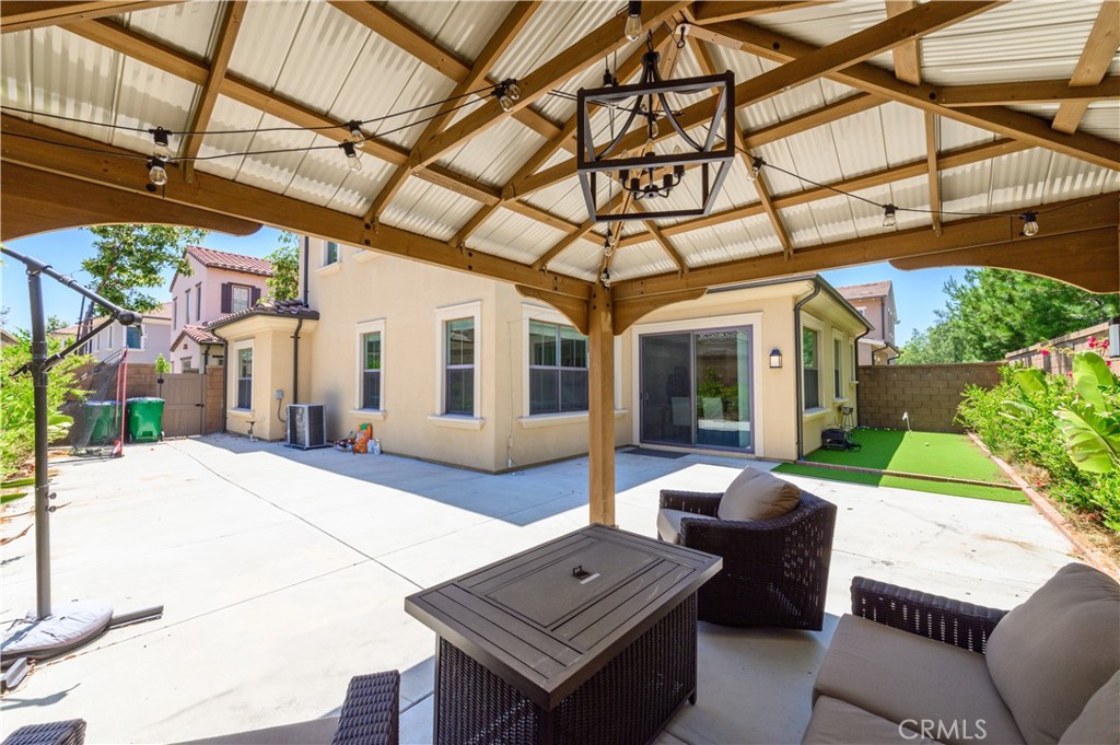 84 Henson Irvine, CA 92620 - Photo 3 of 6 a view of a patio with couches chairs and potted plants