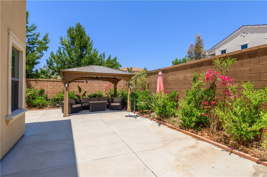 84 Henson Irvine, CA 92620 - Photo 4 of 6 a view of a patio with a table and chairs under an umbrella