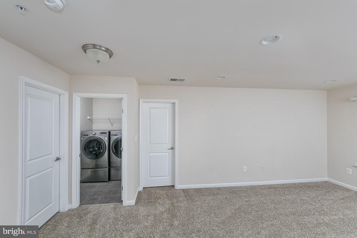 5613 Country Farm Road White Marsh, MD 21162 - Photo 18 of 23 Bedroom-level family room and laundry room