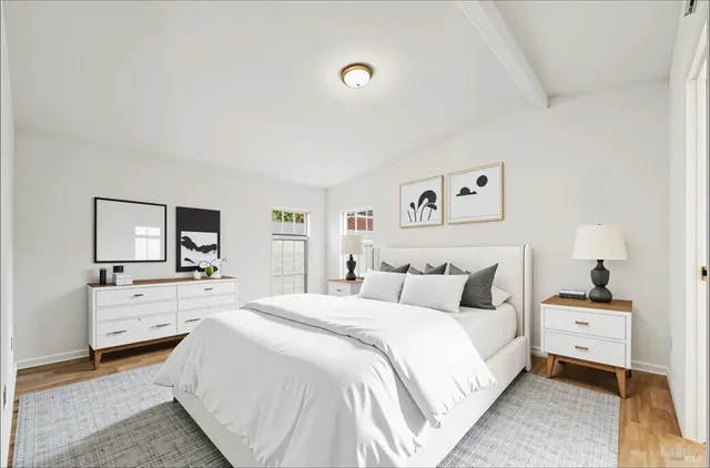 a bedroom with a bed and a couch