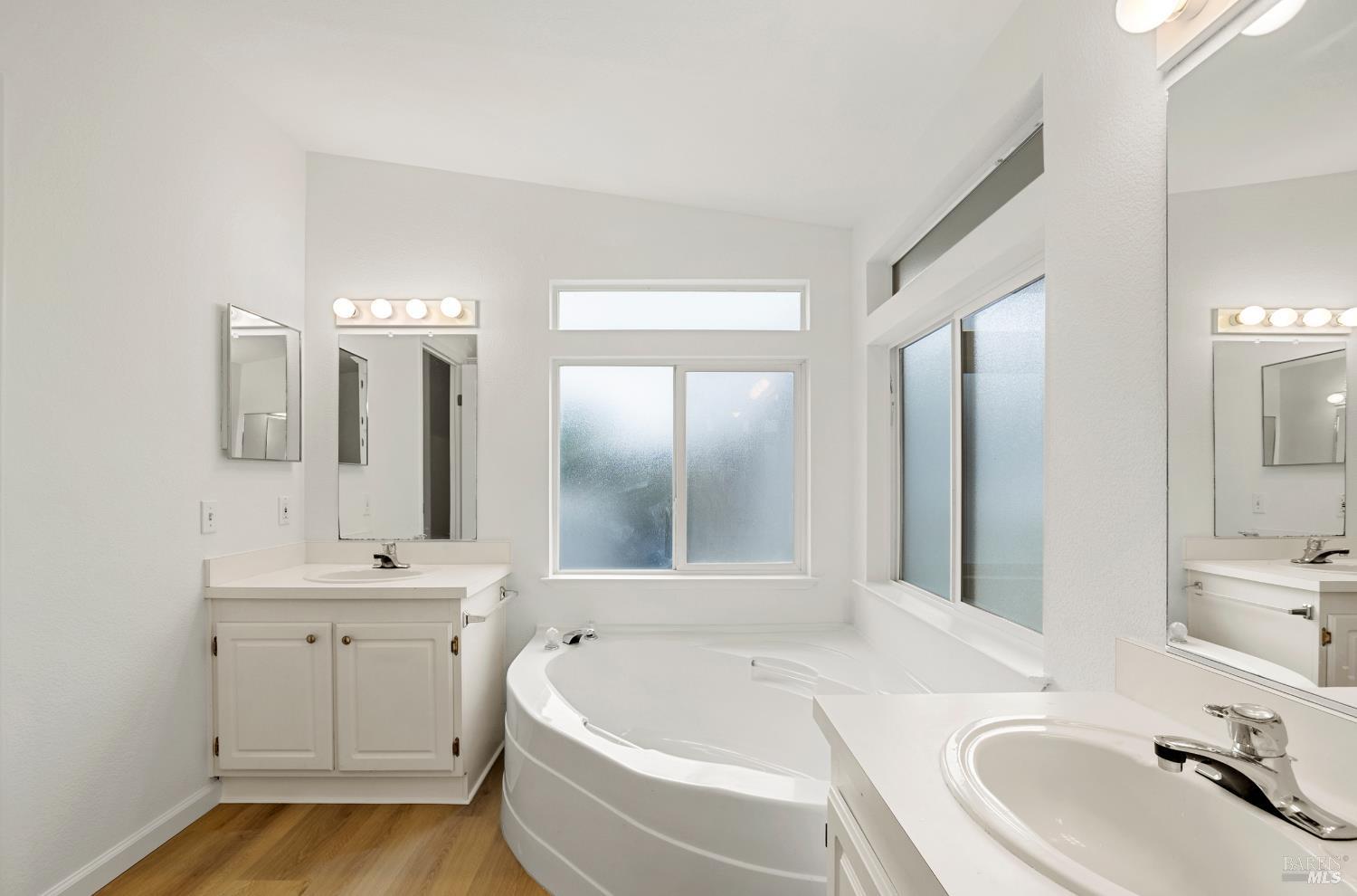 2412 Foothill Boulevard, Unit 41 Calistoga, CA 94515 - Photo 17 of 33 a bathroom with a bathtub sink and mirror