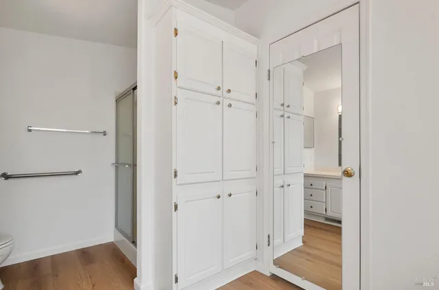 a view of a bathroom with wooden floor