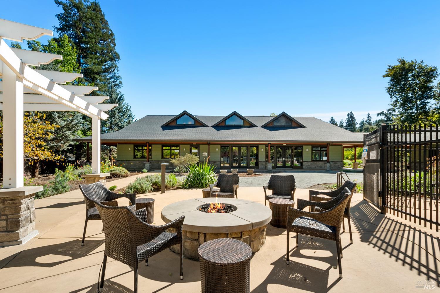 2412 Foothill Boulevard, Unit 41 Calistoga, CA 94515 - Photo 29 of 33 a view of a patio with table and chairs potted plants with wooden floor and fence