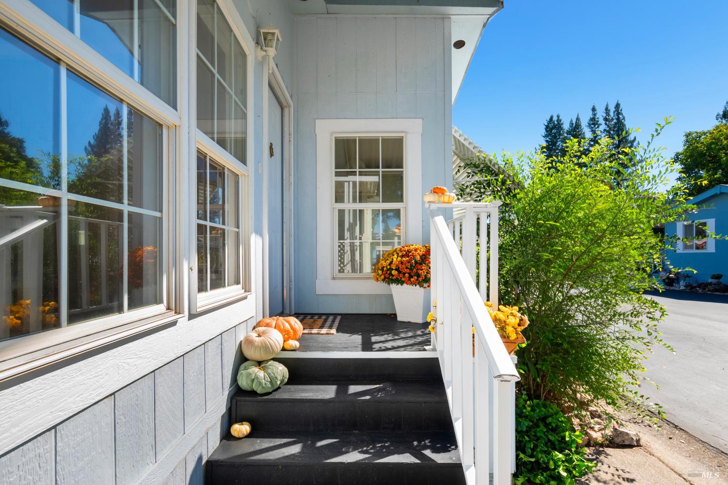 2412 Foothill Boulevard, Unit 41 Calistoga, CA 94515 - Photo 4 of 33 a view of a couches and dinning table and chairs in patio