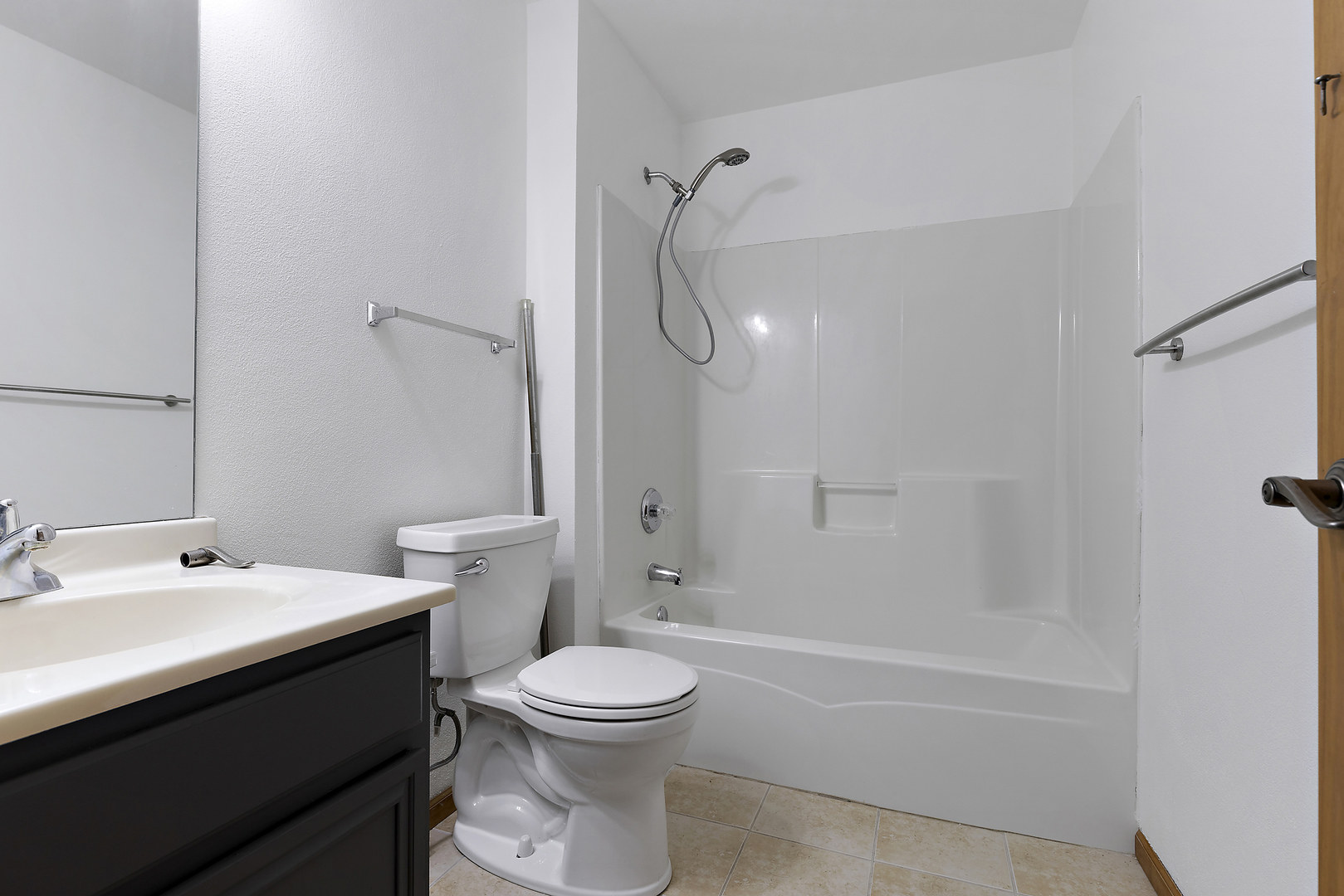 10050 Skipperling Road, Unit 1 Roscoe, IL 61073 - Photo 9 of 15 a bathroom with a sink a toilet and shower