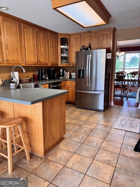 495 Hanley Road Hull, GA 30646 - Photo 14 of 36 a kitchen with stainless steel appliances granite countertop a stove a sink and a refrigerator