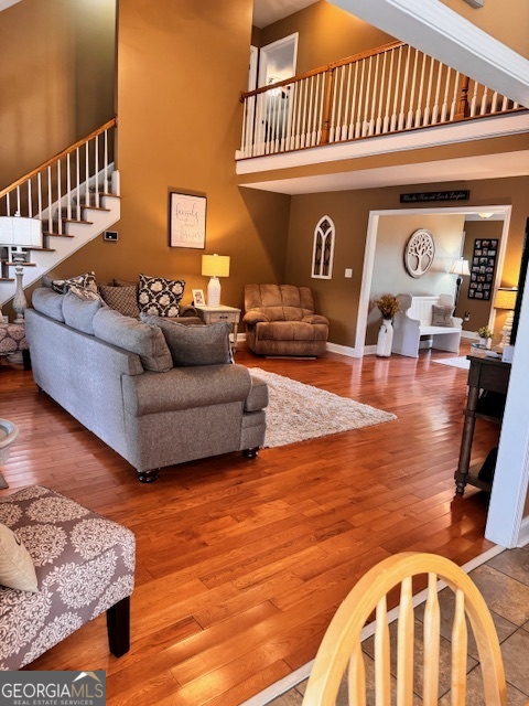 495 Hanley Road Hull, GA 30646 - Photo 15 of 36 a living room with furniture and a wooden floor