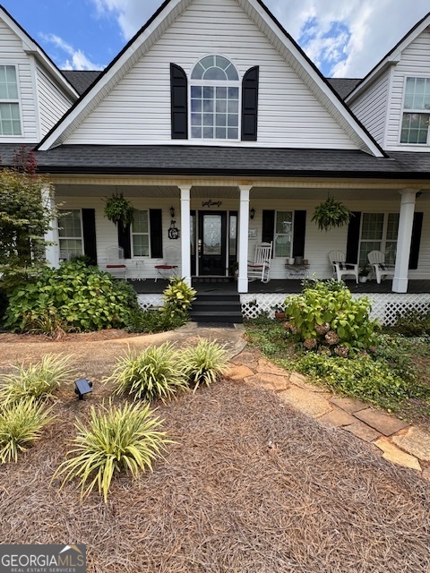 495 Hanley Road Hull, GA 30646 - Photo 2 of 36 a front view of a house with a yard