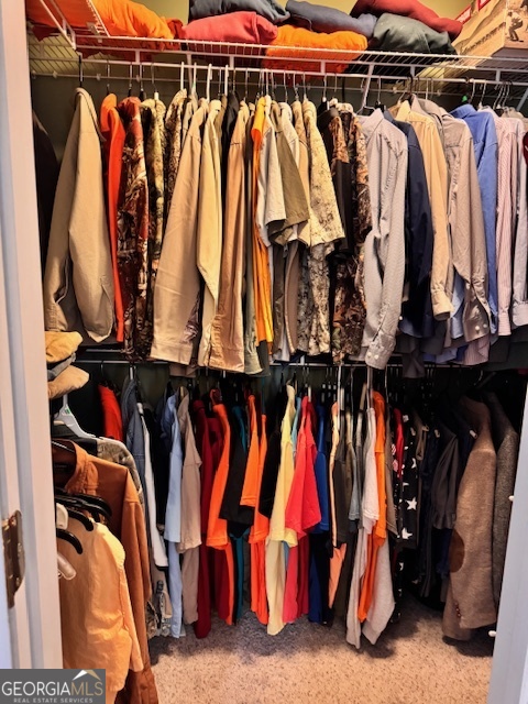 495 Hanley Road Hull, GA 30646 - Photo 23 of 36 a view of walk in closet with clothes