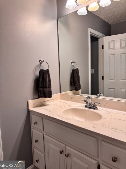 495 Hanley Road Hull, GA 30646 - Photo 26 of 36 a bathroom with a sink vanity and a mirror