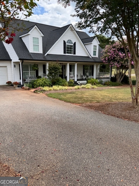 495 Hanley Road Hull, GA 30646 - Photo 3 of 36 a front view of a house with a yard