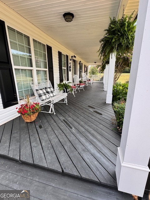 495 Hanley Road Hull, GA 30646 - Photo 4 of 36 a view of living room and patio with wooden floor