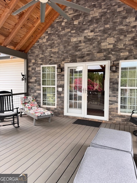 495 Hanley Road Hull, GA 30646 - Photo 7 of 36 a view of a patio with chairs and floor to ceiling window
