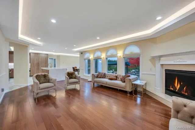 a kitchen with stainless steel appliances granite countertop a table chairs sink and cabinets